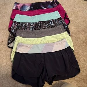Lululemon athletic shorts four pairs of size 4. In great condition.